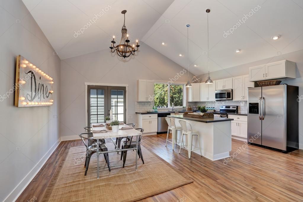 Interior Of Kitchen And Dining Room With High Vaulted