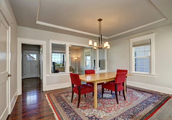 American dining room interior with table and red chairs — Stock Photo, Image