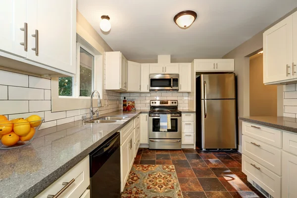 Simple yet practical kitchen interior with white cabinets — Stock Photo, Image