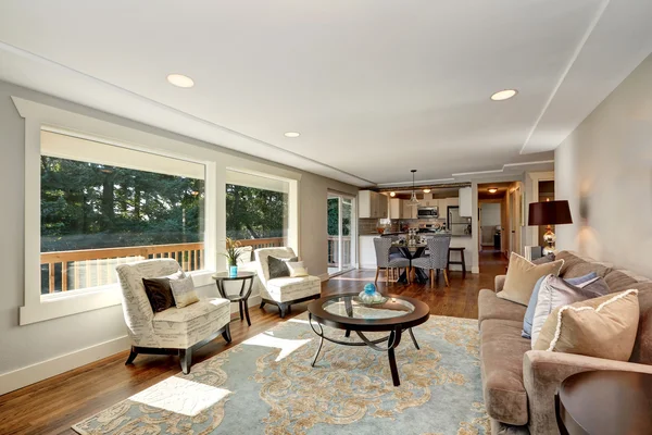 Cozy living room interior with hardwood floor and window view. Royalty Free Stock Images