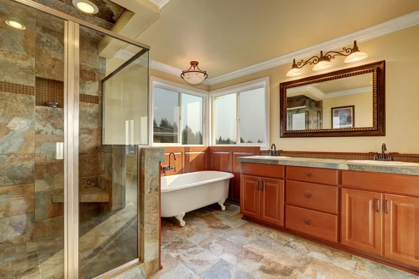 Bathroom with beige tile trim and glass shower. — Stock Photo, Image