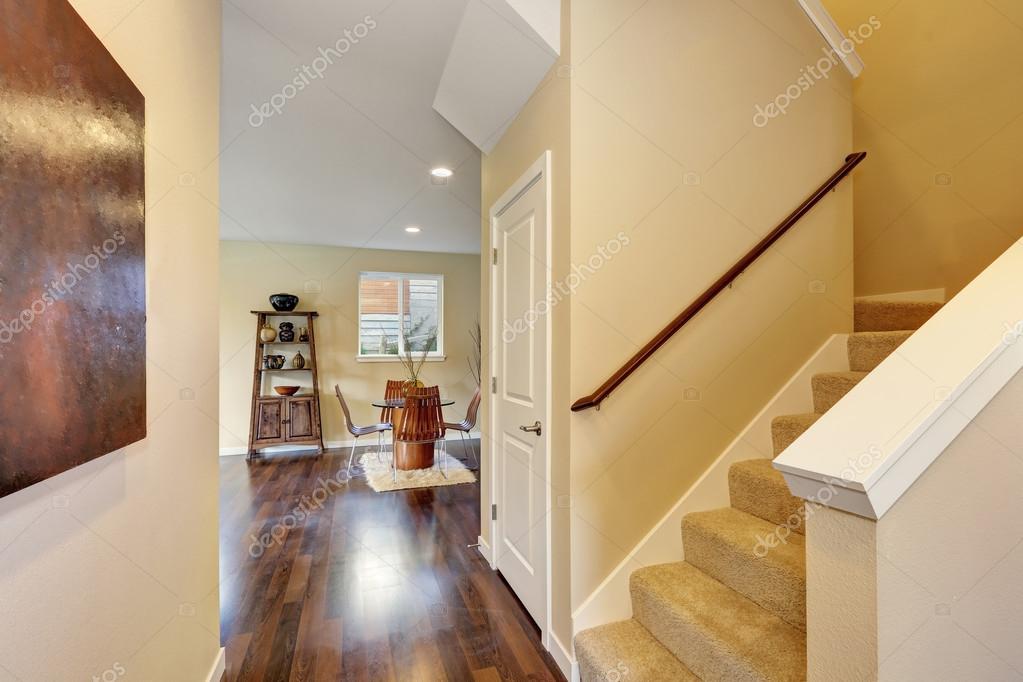 Hallway Interior In Soft Beige Colors And Dark Hardwood Floors