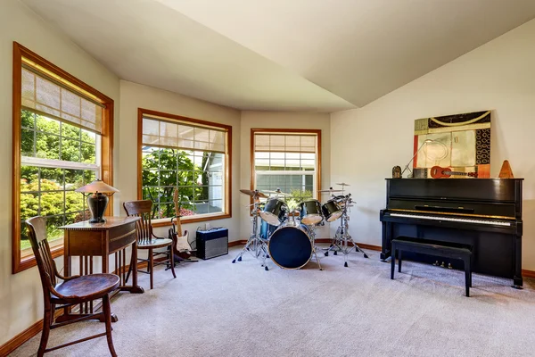 Musician's room interior with drum set, guitars and piano. — Stock Photo, Image