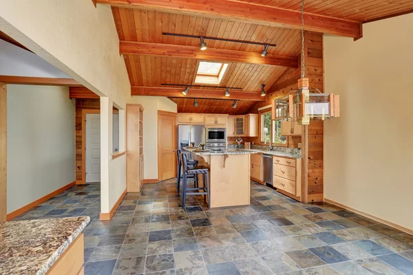 Wooden trim home with open floor plan. Kitchen with granite counter top. — Stock Photo, Image