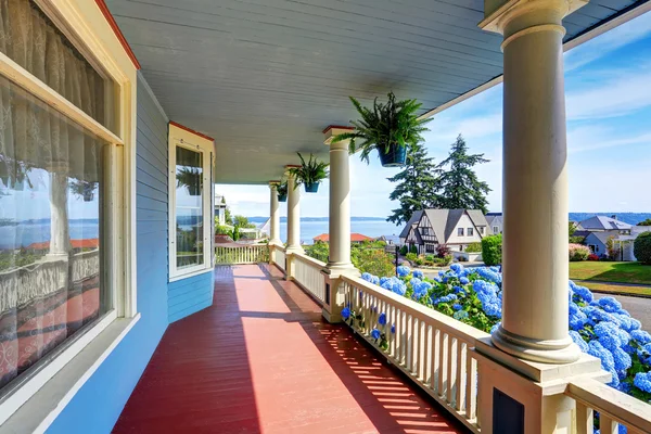 Wooden walkout porch of craftsman American house in blue tones — Stok fotoğraf