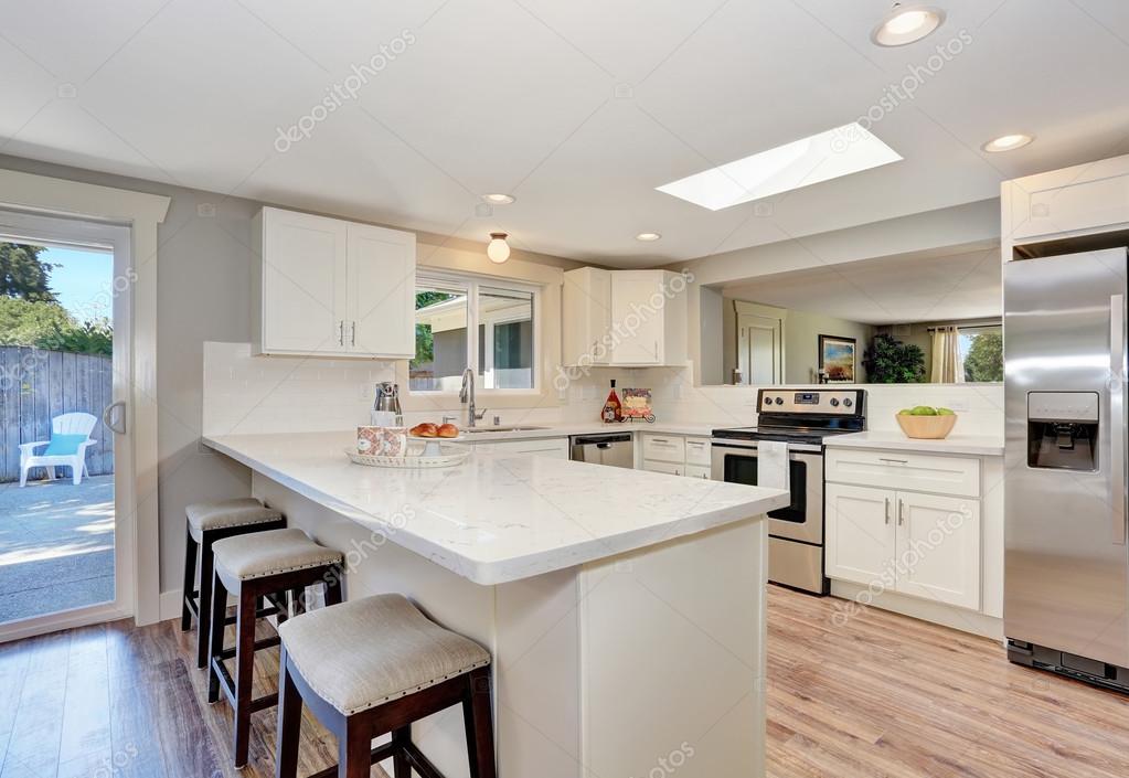 Modern kitchen room interior in white tones with hardwood floor