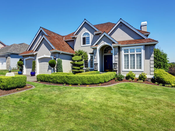 Luxury residential house with perfectly kept front garden.