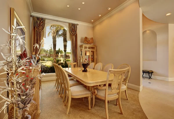 Luxury beige dining room interior with large window — Stock Photo, Image