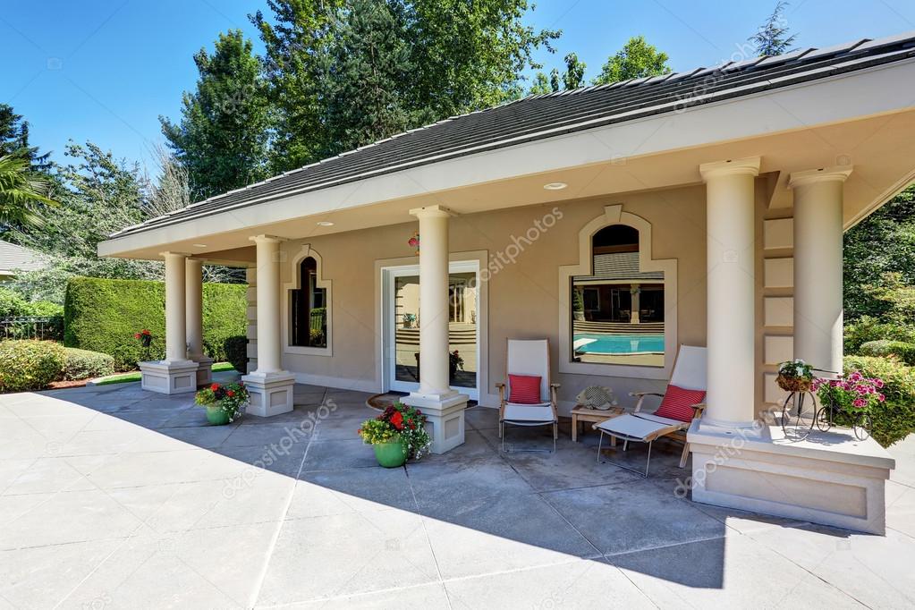 View of luxury guest house with column porch. 