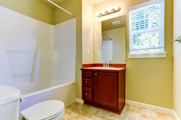 Simple bathroom interior with vanity cabinet and mirror — Stock Photo, Image