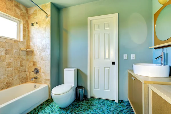 Bathroom interior in light blue with tile wall trim — Stock Photo, Image