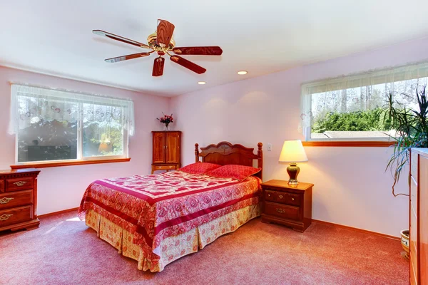 Bright red room with carved wood furniture — Stock Photo, Image