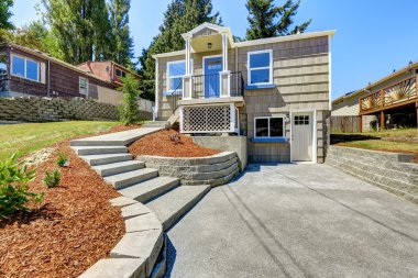 American house exterior with concrete walkway clipart