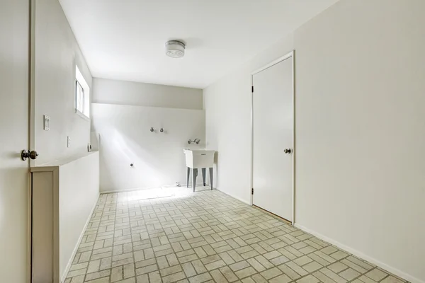 Spacious laundry room in empty house — Stock Photo, Image