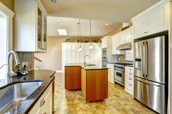 Kitchen room with island and skylight. Stock Photo