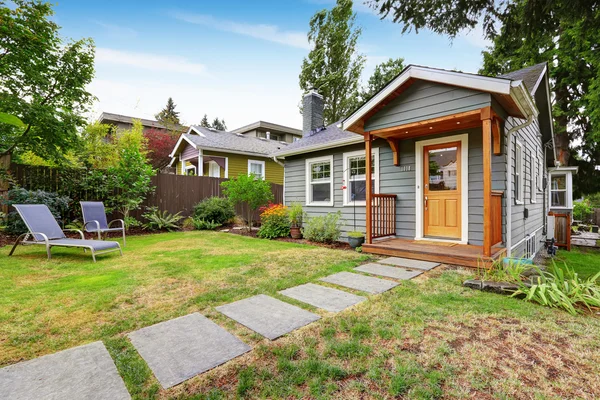 Grey old house with wooden trim Stock Photo