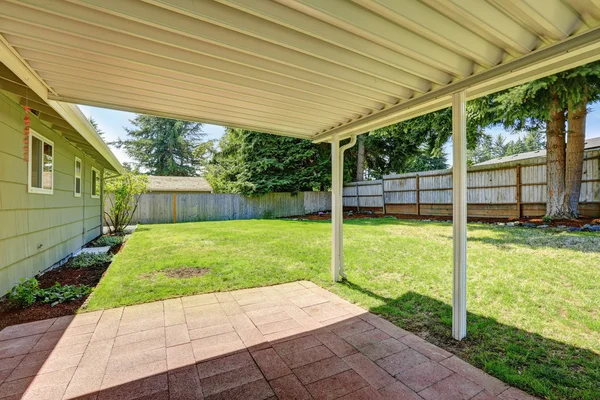 Backyard patio with brick tile floor — Stock Photo, Image