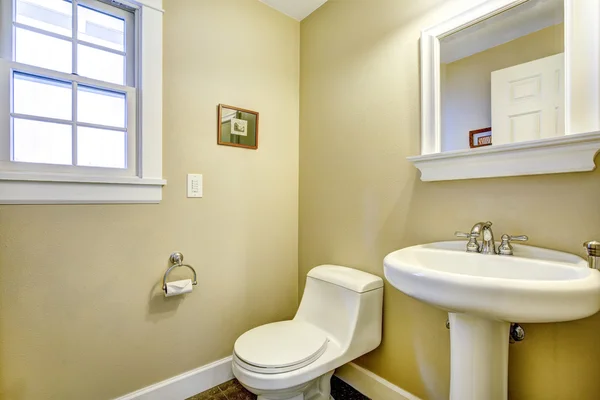 Light yellow bathroom with window — Stock Photo, Image