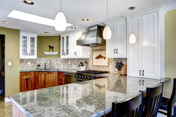 Modern house interior. Kitchen room with shiny granite tops and Stock Image