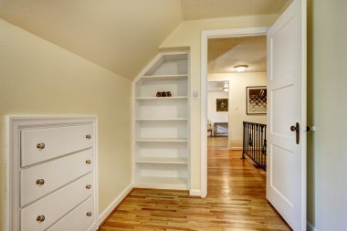 Room with built-in drawers and shelves clipart