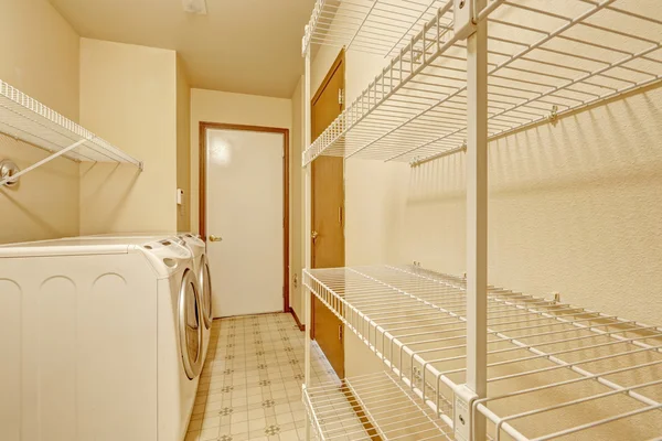 Empty laundry area with mobile racks — Stock Photo, Image