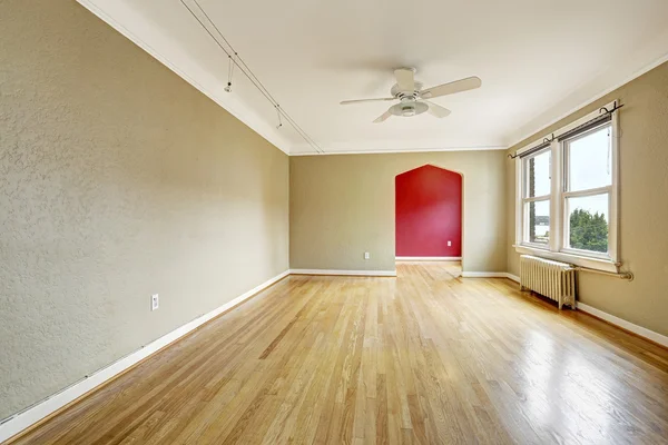 Old apartment interior. Empty living room with radiator