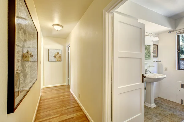 Narrow hallway with exit to bathroom — Stock Photo, Image