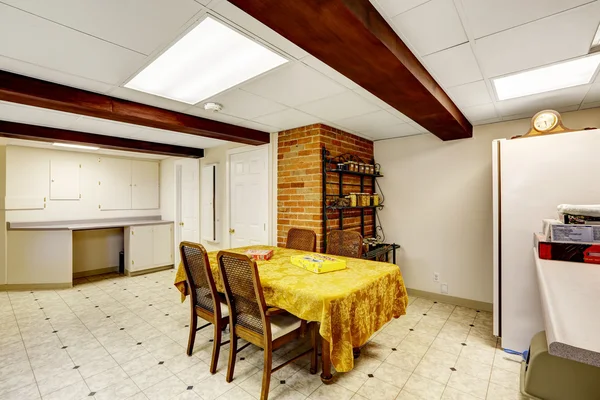 Basement room with dining table — Stock Photo, Image