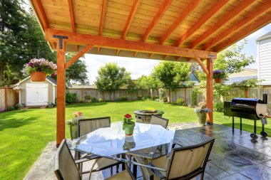 Patio set with glass top table and chairs clipart