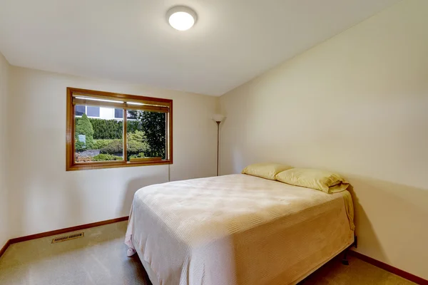 Simple bedroom interior with old bed — Stock Photo, Image