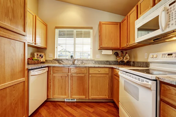 Small kitchen area with white appliances — Stock Photo, Image