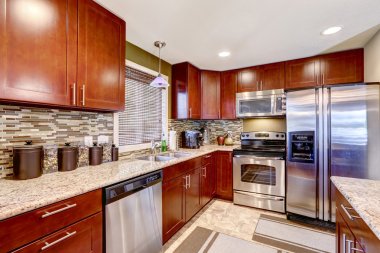Modern kitchen interior with mosaic back splash trim and granite clipart