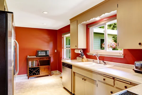 Kitchen room with bright red walls — Stock Photo, Image