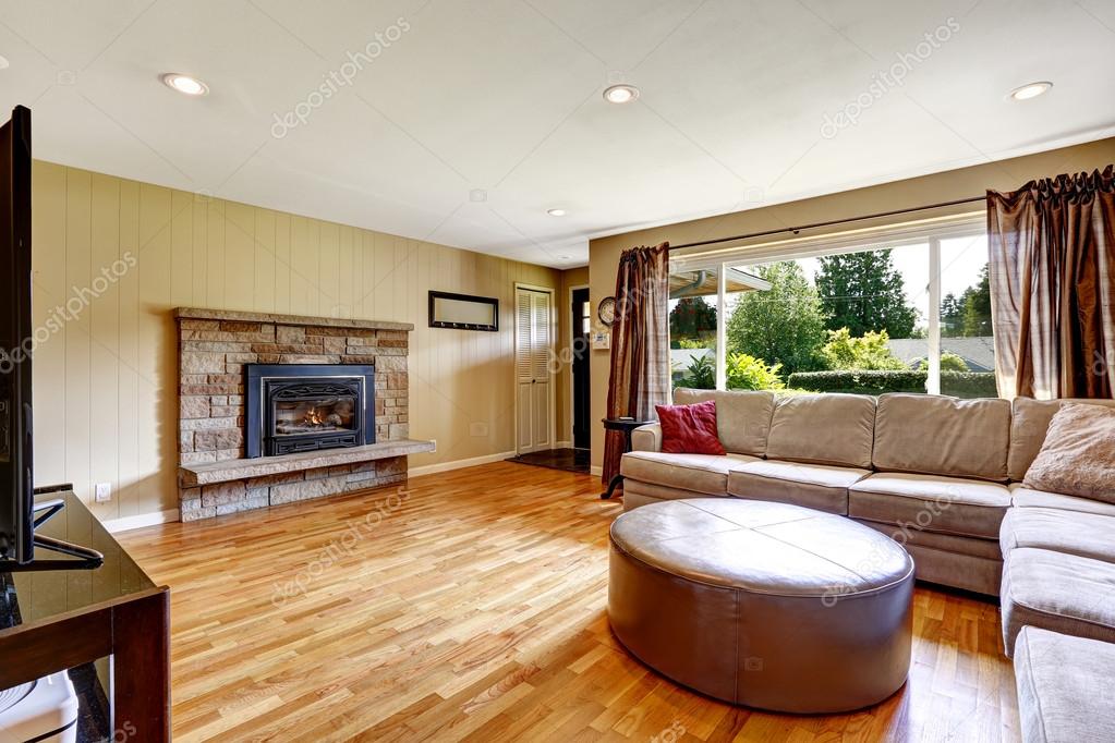 Ottoman In Front Of Fireplace Living Room With Stone Trim