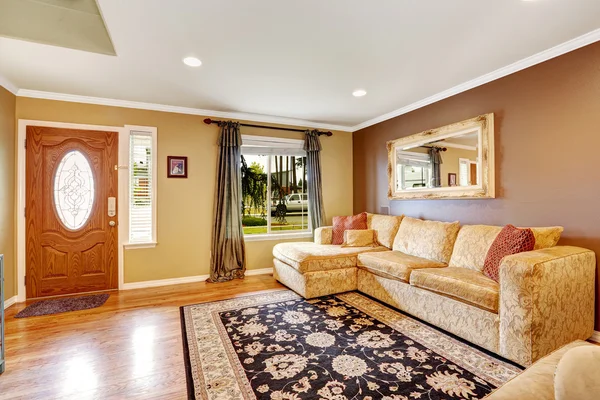 Living room with comfortable creamy tone sofa — Stock Photo, Image
