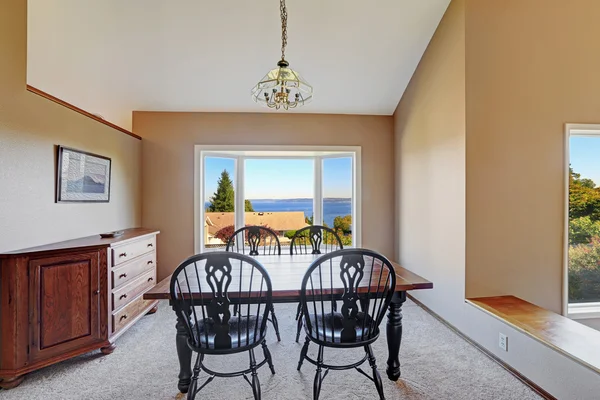 Cozy dining area with scenic window view — Stock Photo, Image