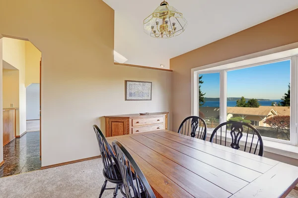 Cozy dining area with scenic window view — Stock Photo, Image