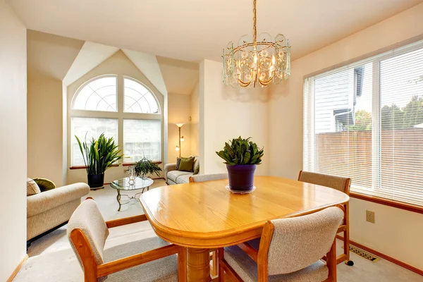 Bright dining area with maple table in luxury house — Stok fotoğraf