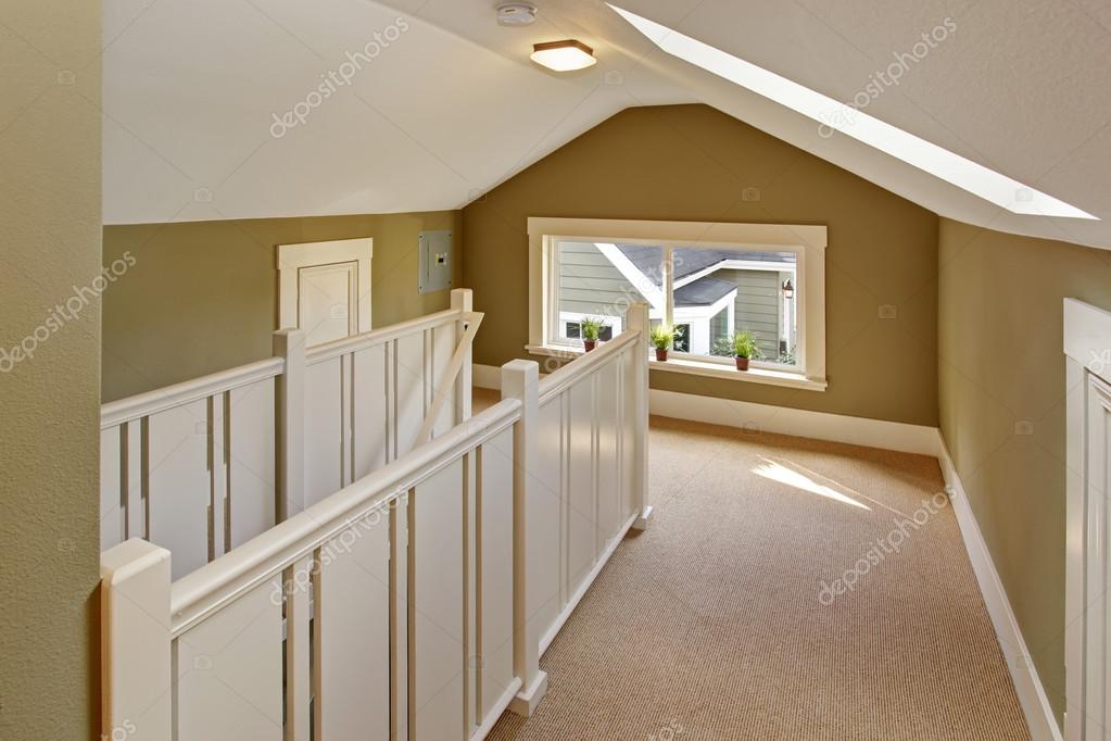 Green And White Upstairs Hallway With Vaulted Ceiling And