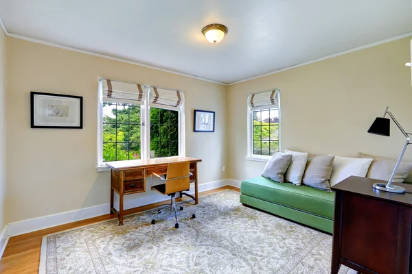 Bright office room with green couch — Stock Photo, Image