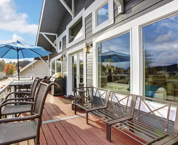 Nothwest traditional wooden deck with chairs and windows. — Stock Photo, Image