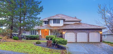 Traditional brick house with garage.