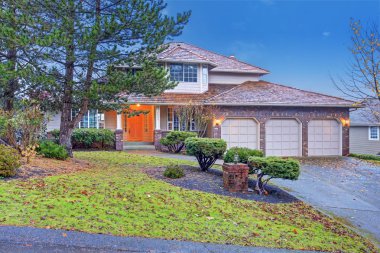 Traditional brick house with garage.