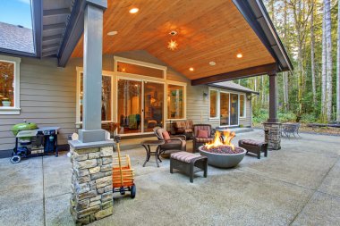 Large back yard with grass.