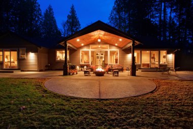 Large back yard with grass.
