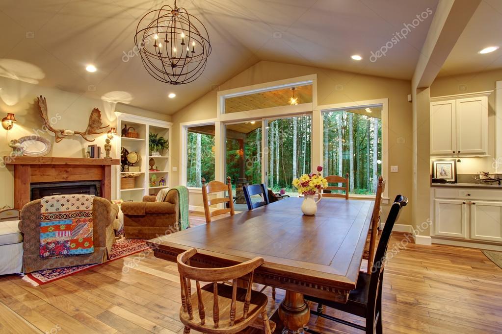 Well Lit Dinning Room With Connected Living Room Stock