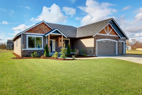 Large modern house with stone and walkway. — Stock Photo, Image