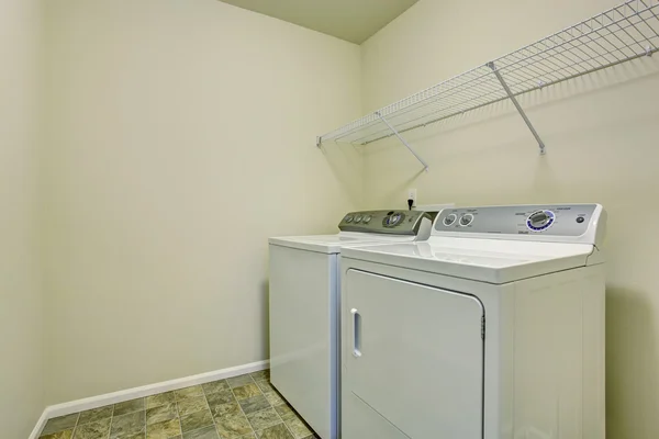 Small laundry room with stone tile floor. — Stock Photo, Image