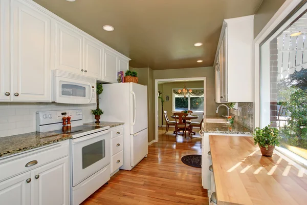 State of the art kitchen with white accents and green walls. — Stock Photo, Image