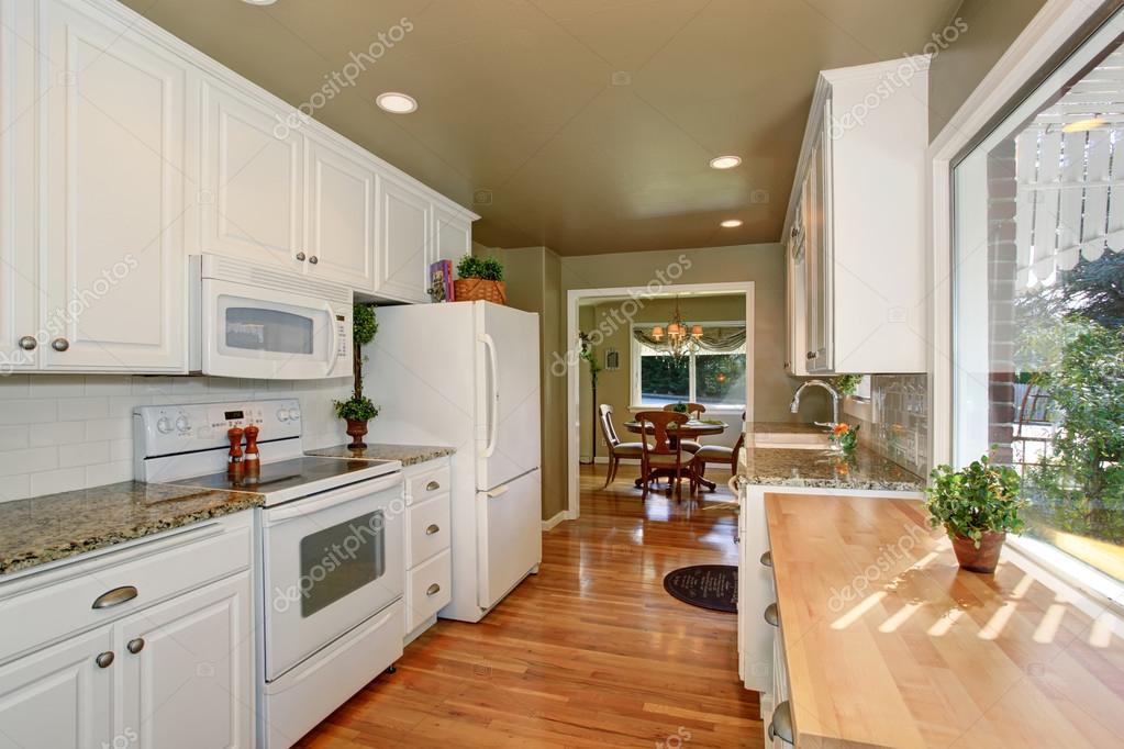 State Of The Art Kitchen With White Accents And Green Walls